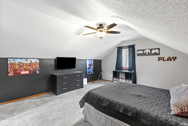 bedroom featuring carpet flooring, ceiling fan, lofted ceiling, and a textured ceiling