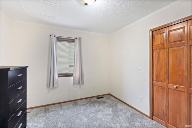 unfurnished bedroom with light colored carpet