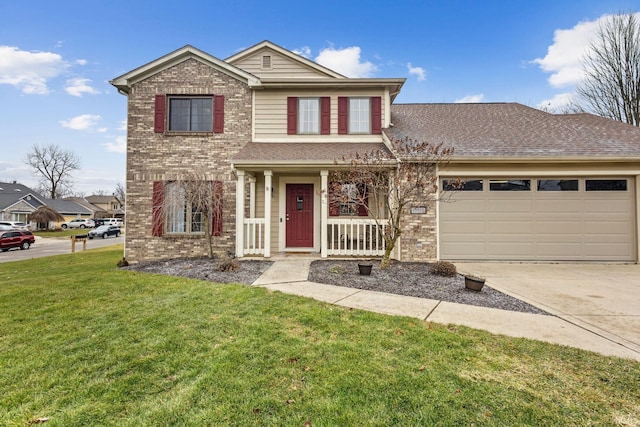 view of property featuring a front lawn, covered porch, and a garage