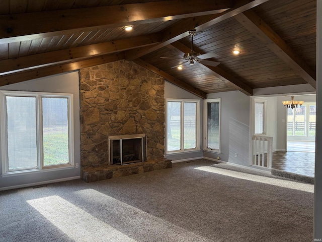 unfurnished living room featuring vaulted ceiling with beams, carpet floors, a fireplace, wood ceiling, and ceiling fan with notable chandelier