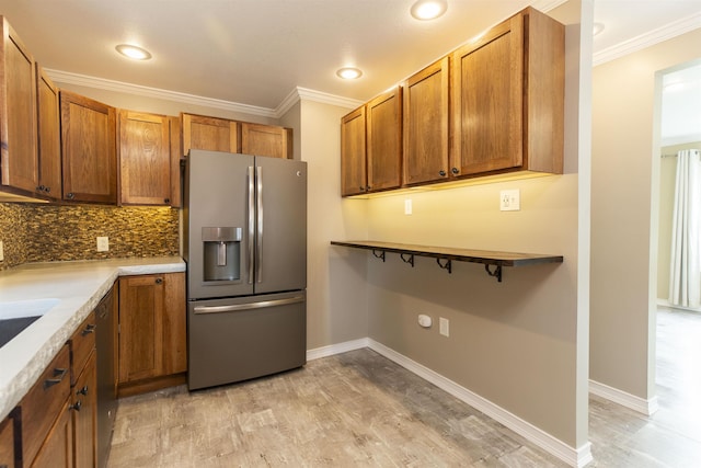 kitchen with tasteful backsplash, stainless steel fridge, light hardwood / wood-style flooring, and crown molding