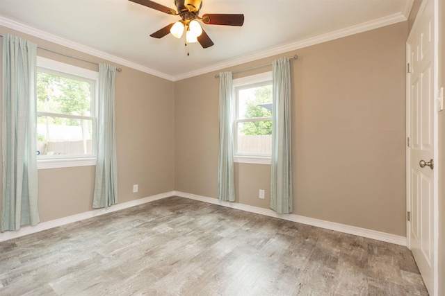 unfurnished room featuring ceiling fan, a healthy amount of sunlight, ornamental molding, and light hardwood / wood-style flooring