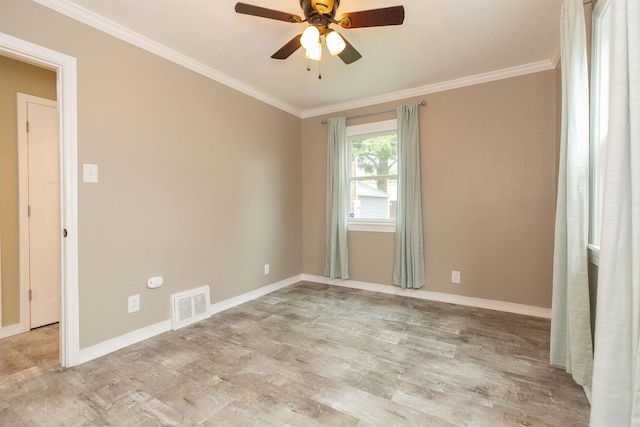 empty room with ceiling fan and ornamental molding