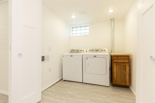 washroom with independent washer and dryer