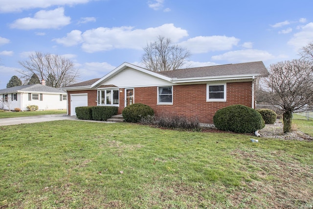 ranch-style home with a front lawn and a garage