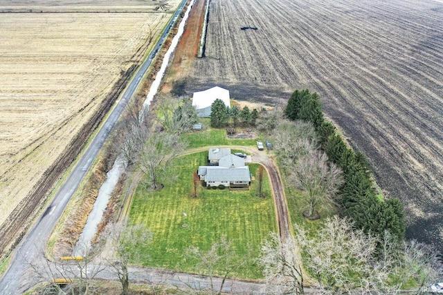 birds eye view of property with a rural view