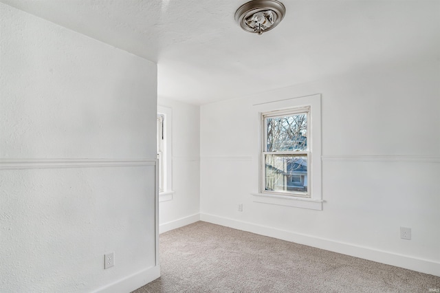 unfurnished room with carpet