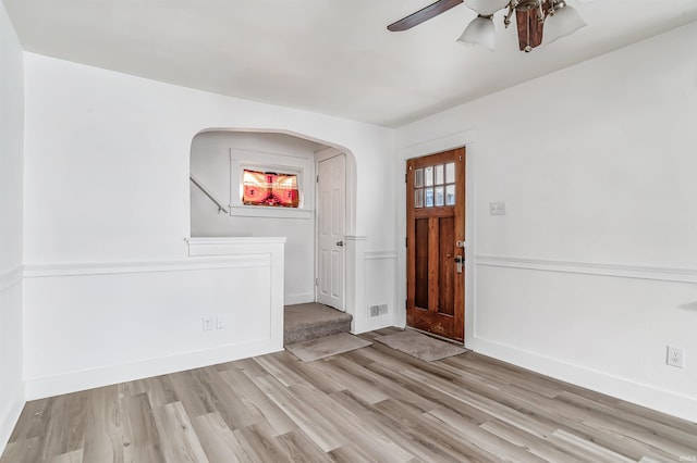 entryway with ceiling fan and light hardwood / wood-style flooring