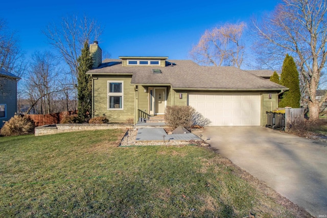 view of front facade featuring a garage and a front lawn