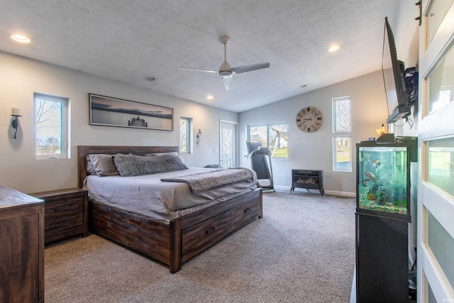 carpeted bedroom featuring ceiling fan, lofted ceiling, and a textured ceiling