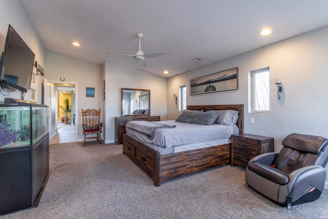 bedroom with light carpet, vaulted ceiling, and ceiling fan