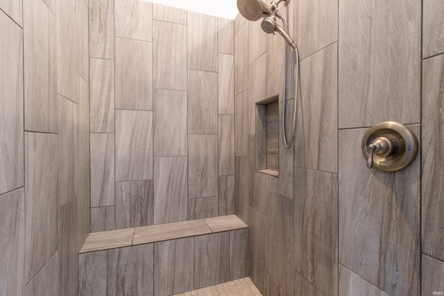 bathroom featuring a tile shower