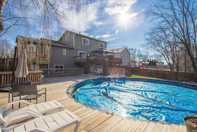 view of swimming pool with a wooden deck