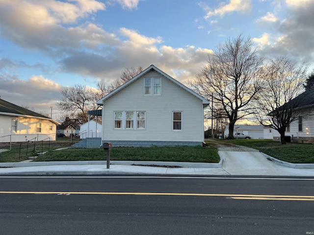 view of side of home featuring a yard