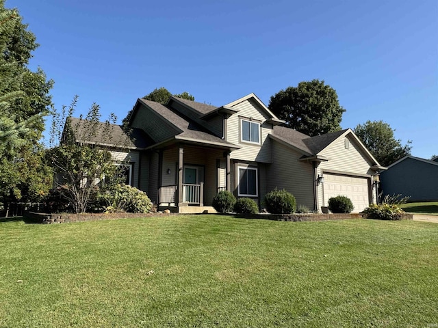 view of front of property featuring a garage and a front lawn