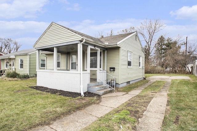 bungalow with a front yard