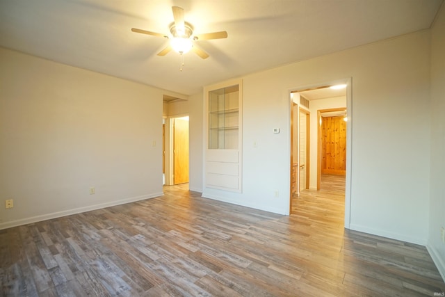 unfurnished bedroom featuring ceiling fan and hardwood / wood-style floors