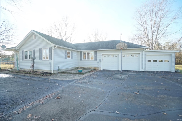 single story home featuring a garage