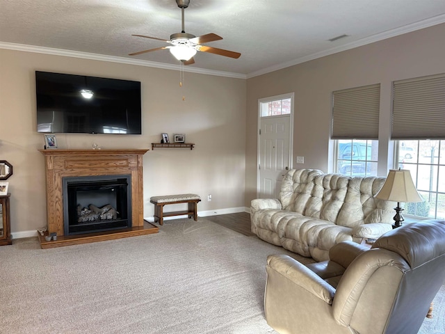 carpeted living room with ceiling fan, crown molding, and a textured ceiling