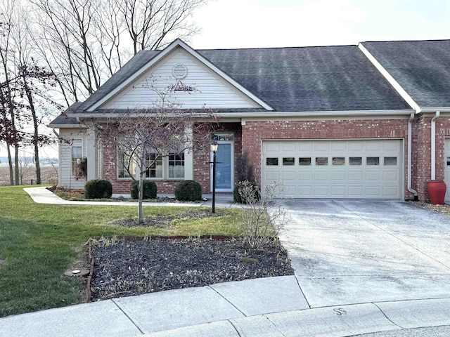 view of front facade with a garage and a front yard