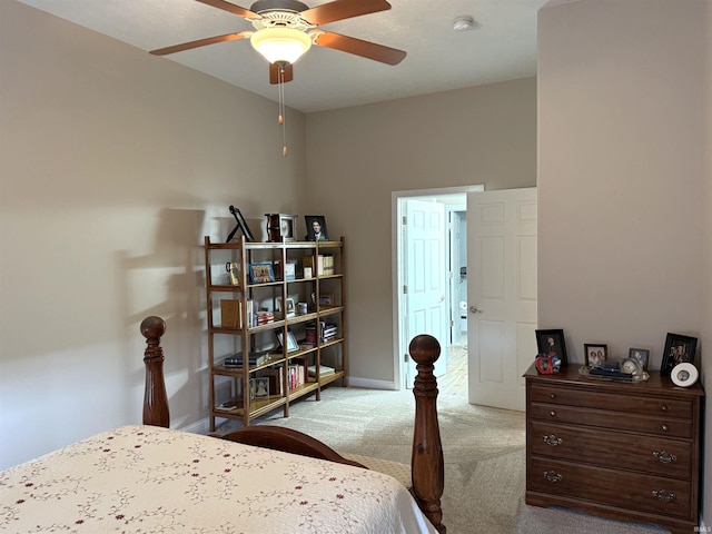 bedroom featuring ceiling fan and light carpet