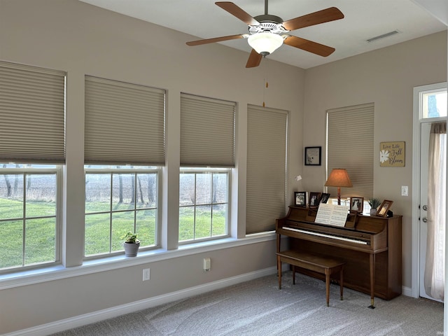 miscellaneous room with carpet flooring and ceiling fan