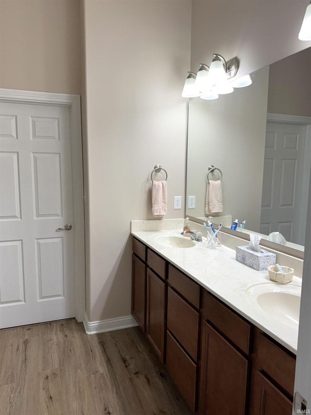 bathroom featuring hardwood / wood-style floors and vanity