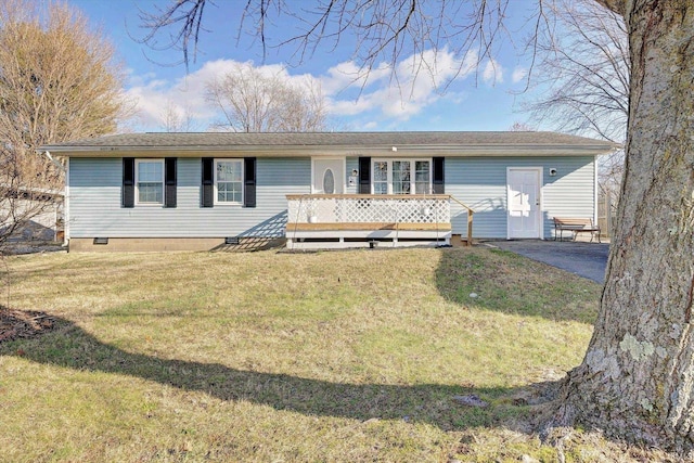 ranch-style house with a wooden deck and a front lawn