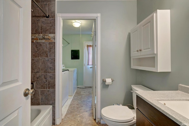 full bathroom featuring vanity,  shower combination, toilet, and independent washer and dryer