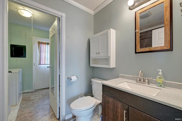 bathroom featuring separate washer and dryer, electric panel, crown molding, toilet, and vanity