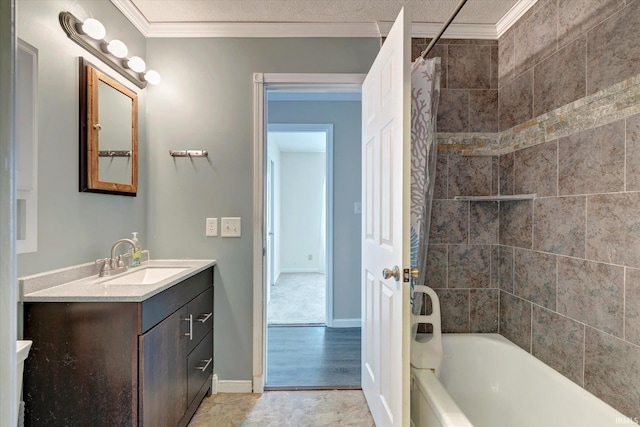 bathroom with crown molding, shower / tub combo with curtain, and vanity