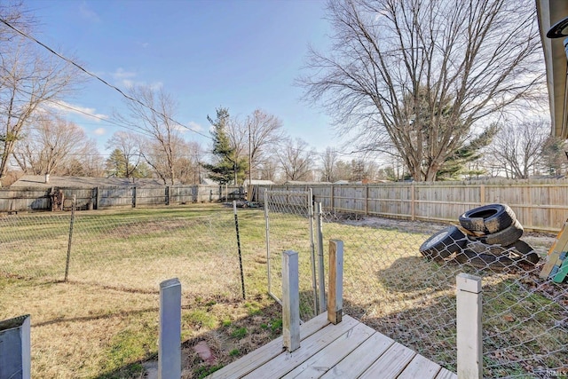 view of yard with a wooden deck