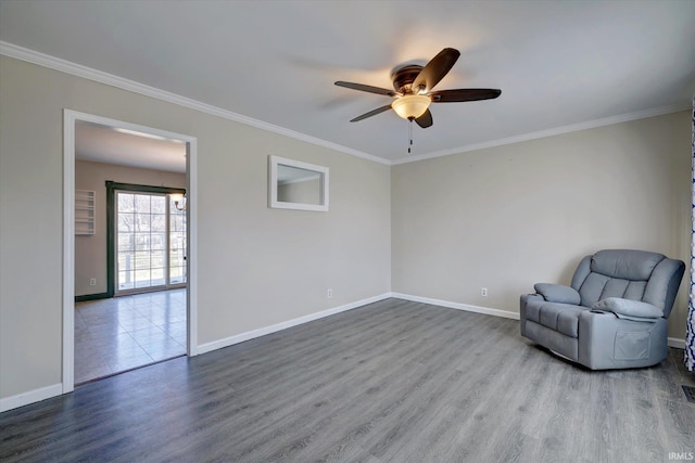 unfurnished room with hardwood / wood-style floors, ceiling fan, and crown molding