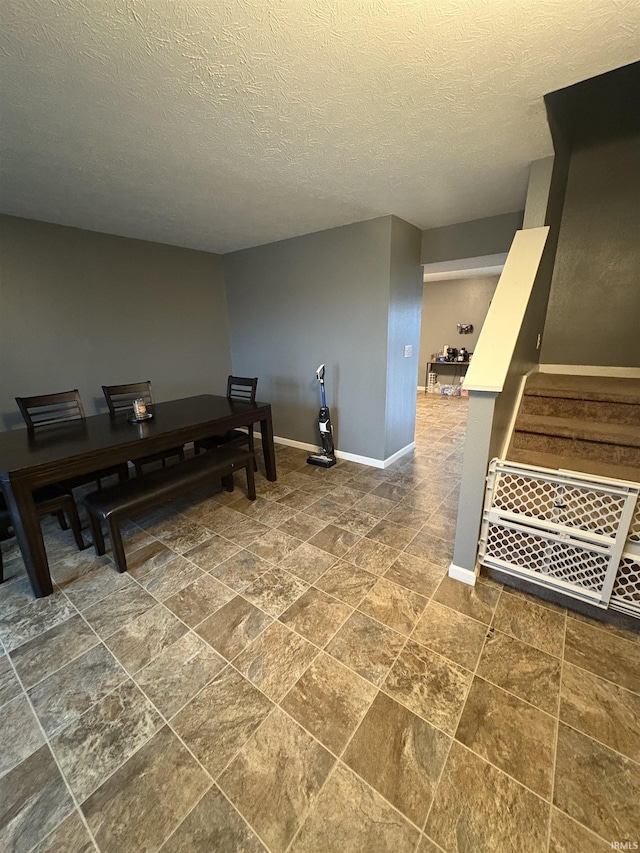 dining area with a textured ceiling