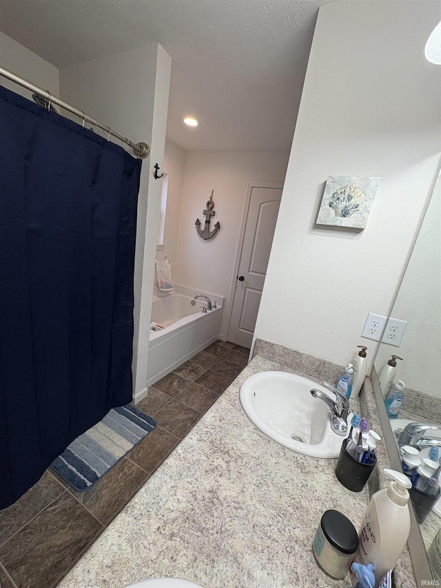 bathroom with separate shower and tub and vanity