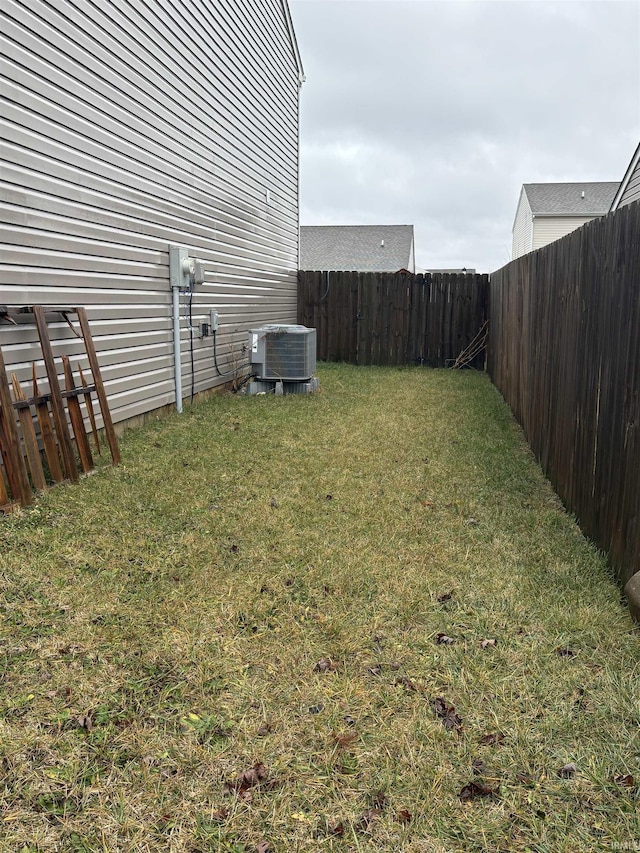 view of yard with central AC unit