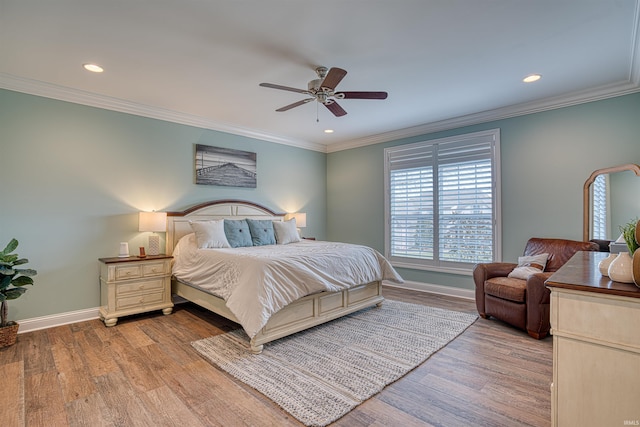 bedroom with ceiling fan, light hardwood / wood-style floors, and ornamental molding