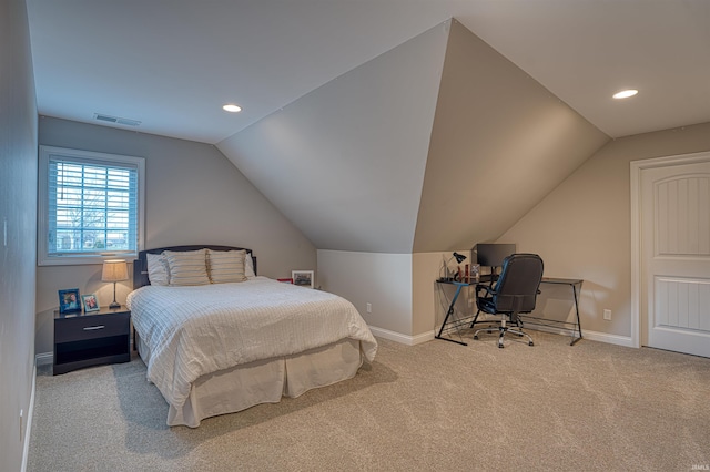 bedroom with light carpet and vaulted ceiling