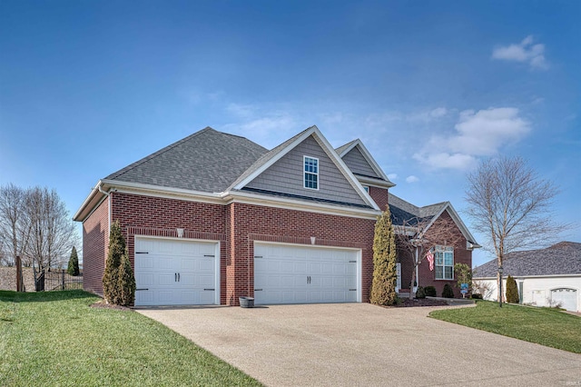 view of front facade with a garage and a front lawn