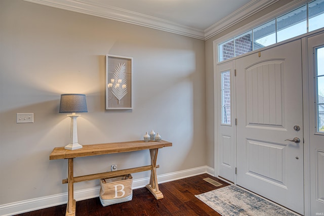 entrance foyer featuring dark hardwood / wood-style flooring and crown molding