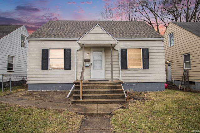 bungalow-style home featuring a yard