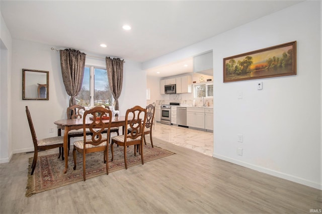 dining room featuring light wood-type flooring