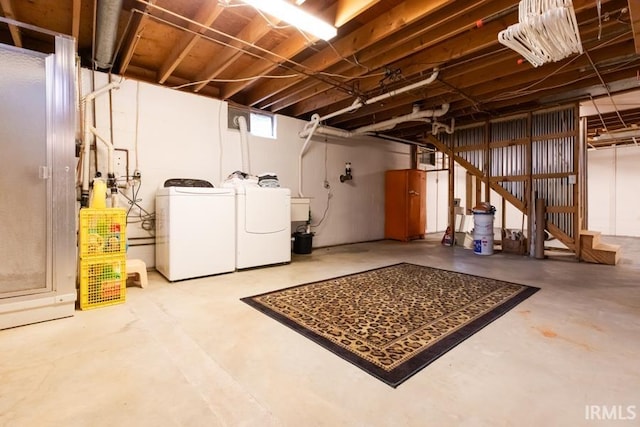 basement with washing machine and clothes dryer