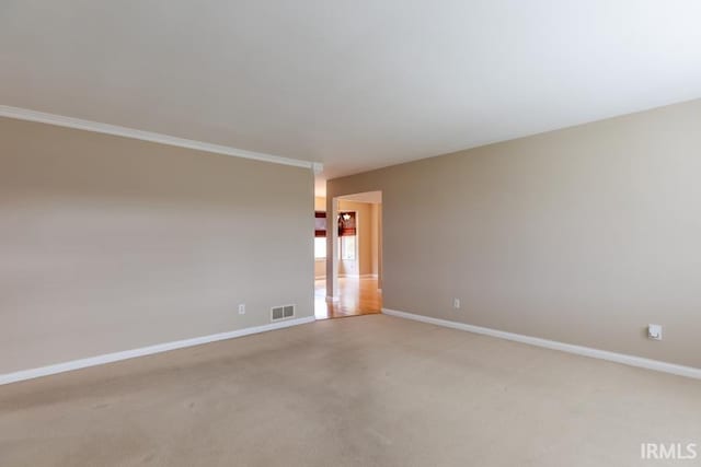 unfurnished room featuring light colored carpet