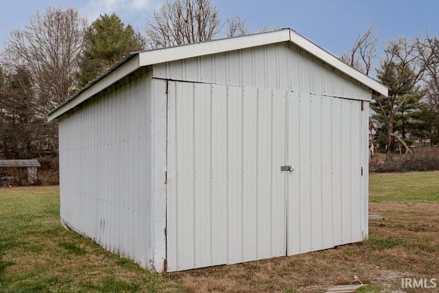 view of outdoor structure with a lawn