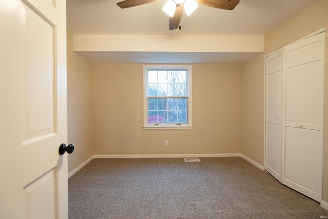 unfurnished bedroom featuring ceiling fan and carpet floors