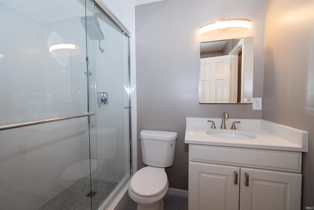 bathroom with vanity, toilet, and walk in shower