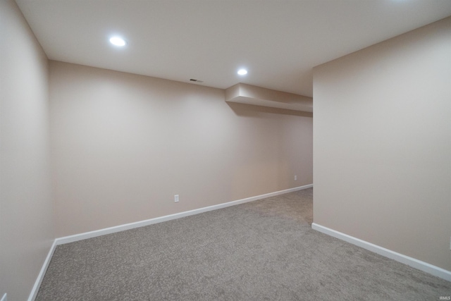 spare room with light colored carpet