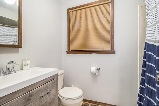 bathroom with vanity and toilet