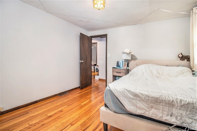 bedroom with light hardwood / wood-style flooring